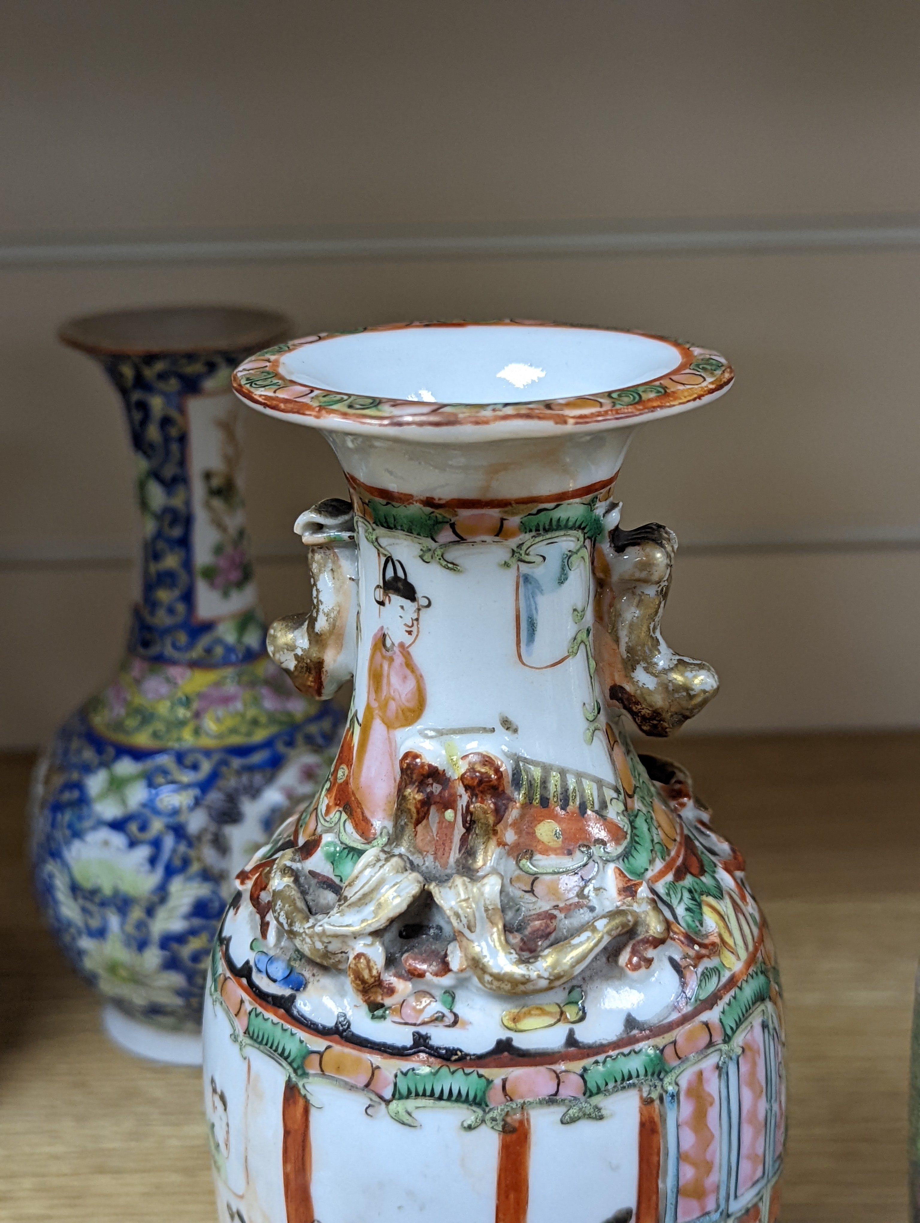 Four 19th century Chinese famille rose vases, 21cm
